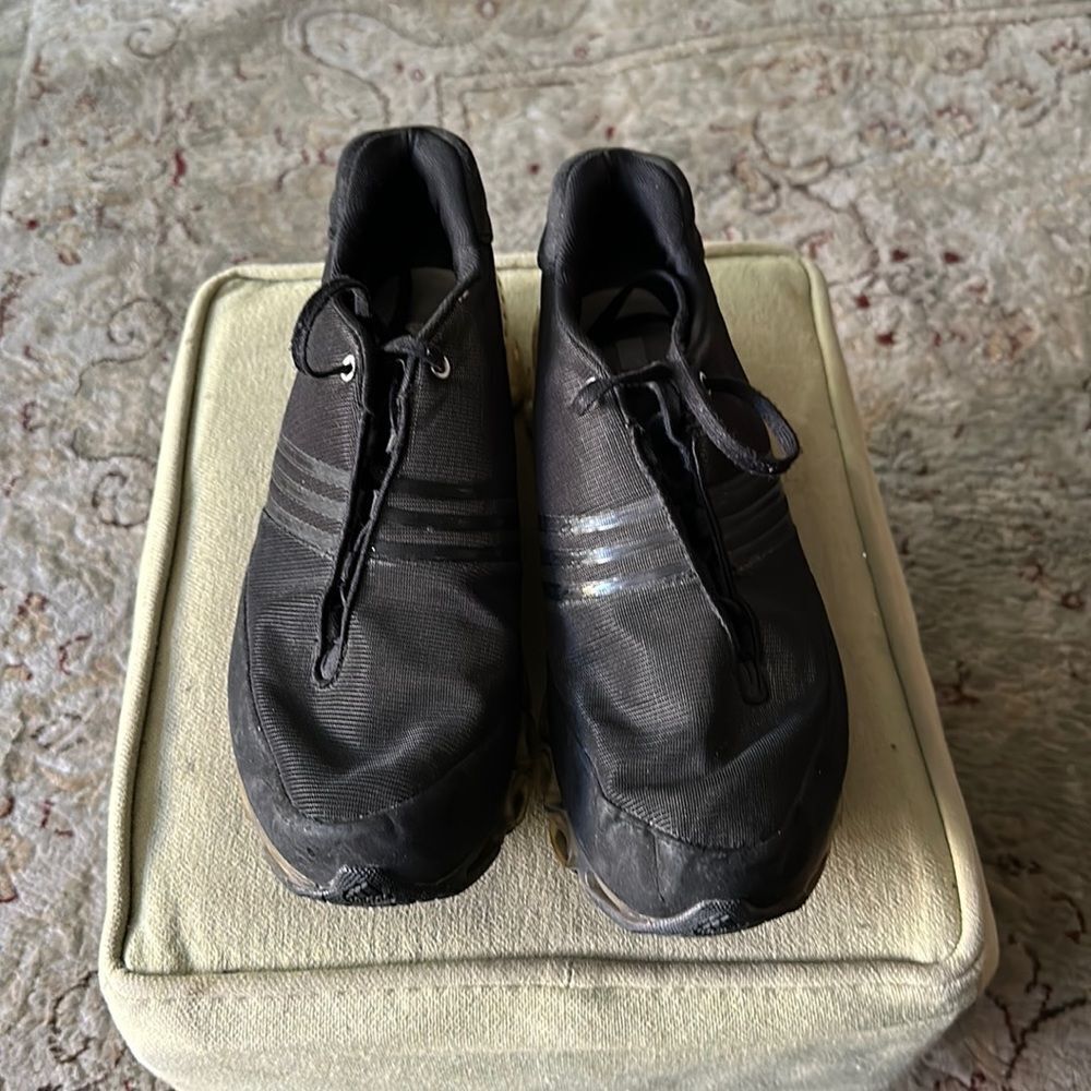 Stella McCartney x Adidas collaboration. Black sneakers.